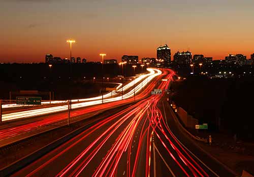 Highway traffic at night representing transportation accidents