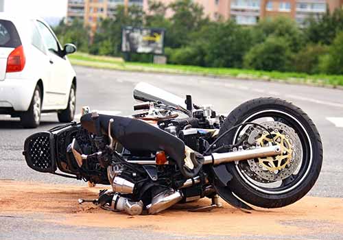 Motorcycle accident scene on road